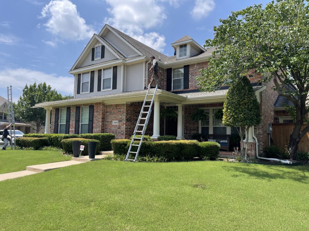 R Lamar Roofing doing a DFW roof repair on a two story house.